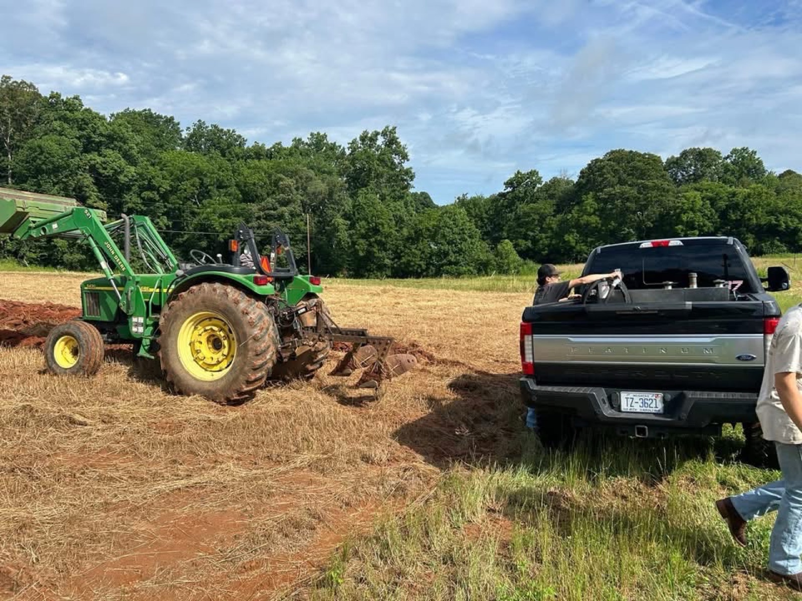 A tractor working the Jones family land beside the farm truck